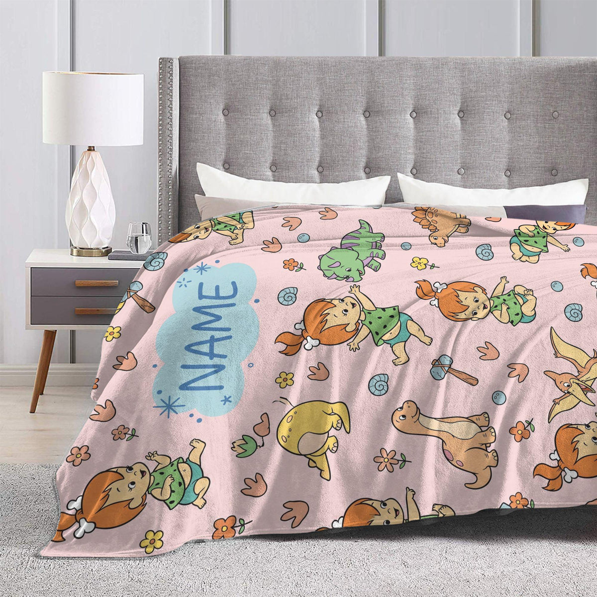 Personalized Prehistoric Girl Flannel Blanket, Custom Bone Hair Baby Throw, Pastel Pink Cave Bedding, Retro Cartoon Nursery Gift
